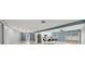 Open concept living area with a view of the kitchen and access to the backyard at 2430 Sunnyside Ln, Sarasota, FL 34239