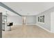 Spacious living room with tile flooring and lots of natural light at 2430 Sunnyside Ln, Sarasota, FL 34239