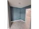 Small office with blue walls and tile floors at 2430 Sunnyside Ln, Sarasota, FL 34239