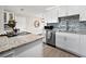 Modern kitchen with white cabinets and granite countertops at 2586 Tami Sola St, Sarasota, FL 34237