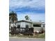 Mobile home with deck and tropical landscaping at 2601 Gulf N Dr # 510, Bradenton Beach, FL 34217