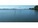 Calm water view with poles and a bird at 2601 Gulf N Dr # 510, Bradenton Beach, FL 34217