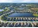 Wide shot of houses along a lake and surrounding area at 26768 Weiskopf Dr, Englewood, FL 34223