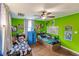 ' bedroom with twin beds and green walls at 27651 State Road 64 E, Myakka City, FL 34251