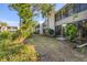 Exterior view of condo building with lush landscaping at 277 Sherwood Dr # 277D, Bradenton, FL 34210