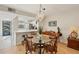 Small dining area with glass-top table and four chairs at 277 Sherwood Dr # 277D, Bradenton, FL 34210
