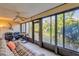 Spacious Florida room with view of the backyard, comfortable seating, and a lovely view at 277 Sherwood Dr # 277D, Bradenton, FL 34210