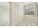 White built-in hall closet with louvered doors at 277 Sherwood Dr # 277D, Bradenton, FL 34210