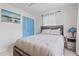 Charming bedroom with a double bed and blue closet doors at 2928 Bahia Vista St, Sarasota, FL 34239