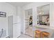 Kitchen with breakfast bar and view into living area at 2928 Bahia Vista St, Sarasota, FL 34239