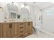 Modern bathroom with double vanity and a walk-in shower at 3066 Highland N St, St Petersburg, FL 33704