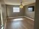 Spacious living room featuring wood-look floors and a ceiling fan at 3136 Webber St, Sarasota, FL 34239