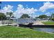 Modern pedestrian bridge over a canal in a residential community at 3217 Bayberry Ter, Sarasota, FL 34237