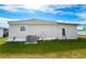 Single wide manufactured home with AC unit, and a nicely landscaped yard at 3217 Bayberry Ter, Sarasota, FL 34237