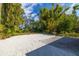 Large backyard with gravel area and bamboo at 327 Hernando Ave, Sarasota, FL 34243