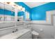 Bright bathroom with white vanity, toilet and tiled walls at 327 Hernando Ave, Sarasota, FL 34243