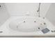 Oval jacuzzi bathtub with tile surround at 327 Hernando Ave, Sarasota, FL 34243