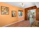 Open dining area with view into kitchen and built-in shelving at 327 Hernando Ave, Sarasota, FL 34243