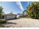 One car garage with large gravel parking at 327 Hernando Ave, Sarasota, FL 34243