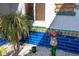 Close up of garden with blue tile, bird bath and plants at 327 Hernando Ave, Sarasota, FL 34243