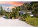 Charming single story home with mature landscaping and a gravel driveway at 327 Hernando Ave, Sarasota, FL 34243
