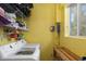 Bright laundry room with washer, dryer, and shelving at 327 Hernando Ave, Sarasota, FL 34243