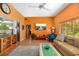 Spacious living area with a large TV and comfy furniture at 327 Hernando Ave, Sarasota, FL 34243