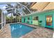 Inviting screened-in pool with patio and landscaping at 327 Hernando Ave, Sarasota, FL 34243