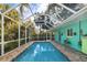 Relaxing screened-in pool and patio area at 327 Hernando Ave, Sarasota, FL 34243