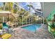 Screened-in pool area with patio furniture at 327 Hernando Ave, Sarasota, FL 34243