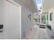 Side yard access with a keypad door and stone path at 327 Hernando Ave, Sarasota, FL 34243