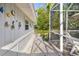 Side yard pathway with seashell decor and screened enclosure at 327 Hernando Ave, Sarasota, FL 34243