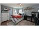 Bright bedroom with double bed, desk, and built-in shelves at 339 Tierra Verde Way, Bradenton, FL 34212