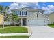 Two-story house with a two-car garage and landscaped lawn at 339 Tierra Verde Way, Bradenton, FL 34212