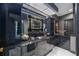 Modern bathroom with dark cabinetry and unique artwork at 340 S Palm Ave # Pl1, Sarasota, FL 34236