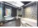 Modern bathroom with glass sink and mosaic tile at 340 S Palm Ave # Pl1, Sarasota, FL 34236