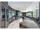 Modern curved kitchen with dark wood cabinets and granite countertops at 340 S Palm Ave # Pl1, Sarasota, FL 34236