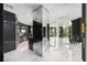 Modern kitchen with black cabinetry and marble flooring at 340 S Palm Ave # Pl1, Sarasota, FL 34236