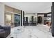 Bright living room with marble floors and access to a balcony at 340 S Palm Ave # Pl1, Sarasota, FL 34236