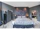 Main bedroom with large swan mural and ensuite bathroom at 340 S Palm Ave # Pl1, Sarasota, FL 34236