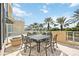 Outdoor patio dining area with seating for six at 340 S Palm Ave # Pl1, Sarasota, FL 34236