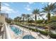 Resort-style pool with lounge chairs and lush landscaping at 340 S Palm Ave # Pl1, Sarasota, FL 34236