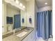 Clean bathroom with single vanity and shower/tub combo at 3640 Tin Cup Blvd, Sarasota, FL 34232