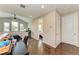 Upstairs hallway with dark hardwood floors and access to bedrooms at 3640 Tin Cup Blvd, Sarasota, FL 34232