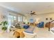 Bright living room with comfortable seating and large TV at 3640 Tin Cup Blvd, Sarasota, FL 34232