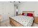 Charming bedroom with wood bed frame and neutral decor at 3704 Wild Blossom Pl, Parrish, FL 34219