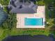 Relaxing community pool with lounge chairs and landscaping at 3704 Wild Blossom Pl, Parrish, FL 34219