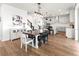 Bright dining area with farmhouse table and chairs, adjacent to kitchen at 3704 Wild Blossom Pl, Parrish, FL 34219