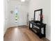Bright entryway with wood floors and a console table at 3704 Wild Blossom Pl, Parrish, FL 34219