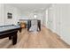 Upstairs game room features a pool table and ample space for entertainment at 3704 Wild Blossom Pl, Parrish, FL 34219